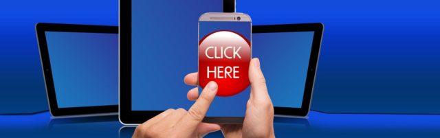 スマホとclickhereの画像